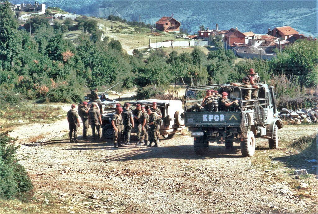 1024px-German_KFOR_troops_patrol_southern_Kosovo_summer_1999.jpg