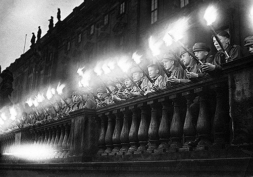 Torch-bearing Hitler Youth form a guard of honor, 1934