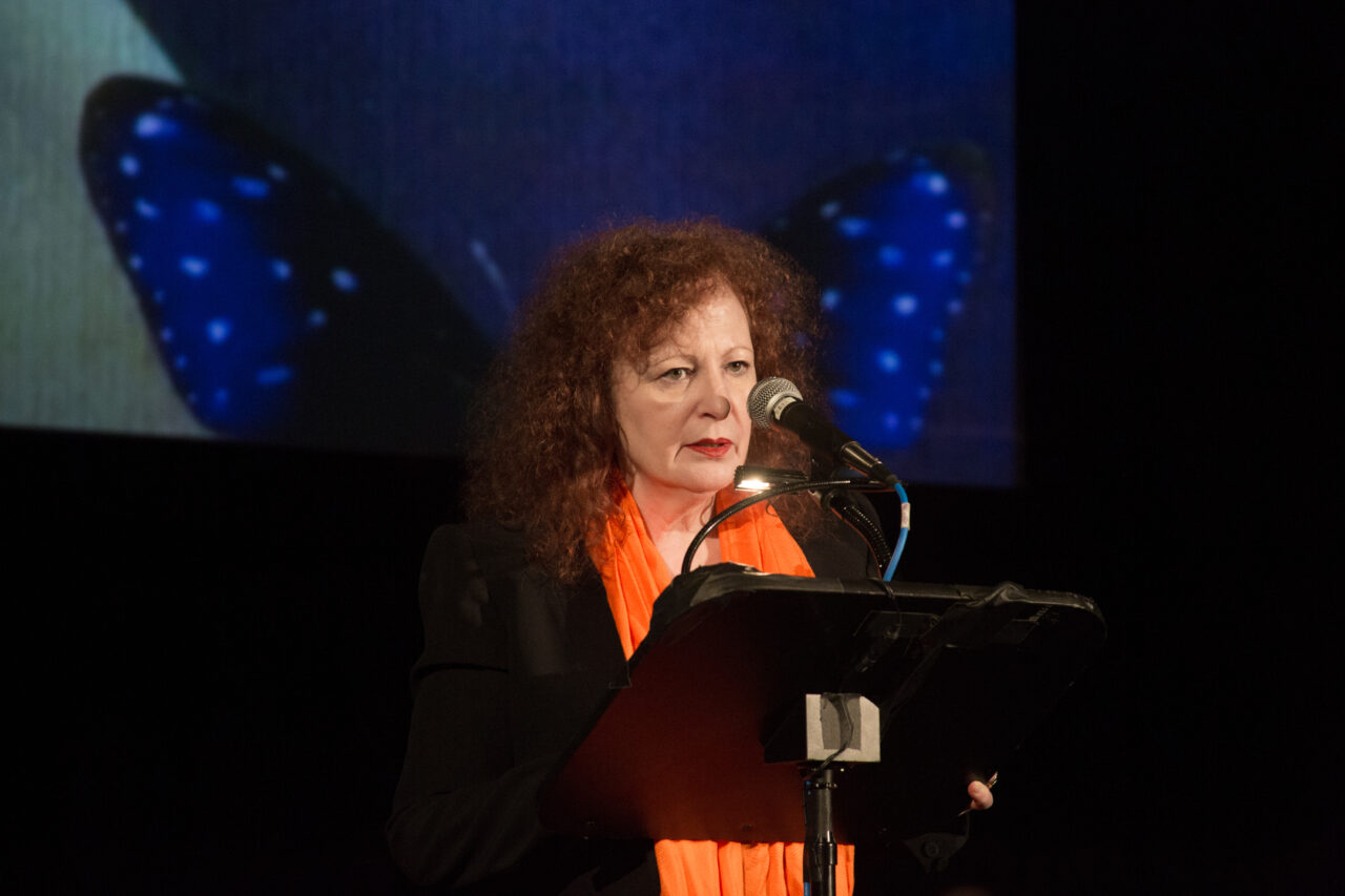 Nan Goldin reads during The theatrical performance “Ferite a Morte," translated as “Wounded to Death," which was performed during the official commemoration of the International Day to End Violence against Women